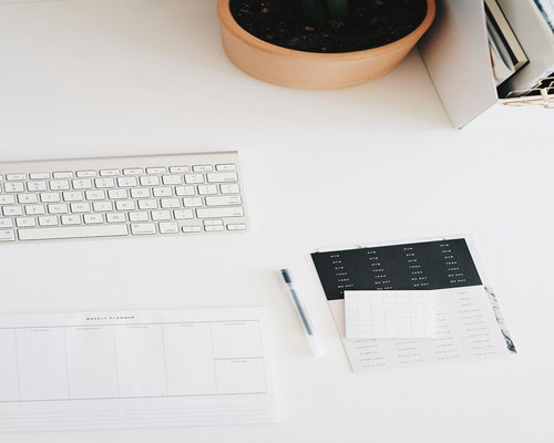 A clean desk layout emphasizing personal care, wellness logs, and an organized routine